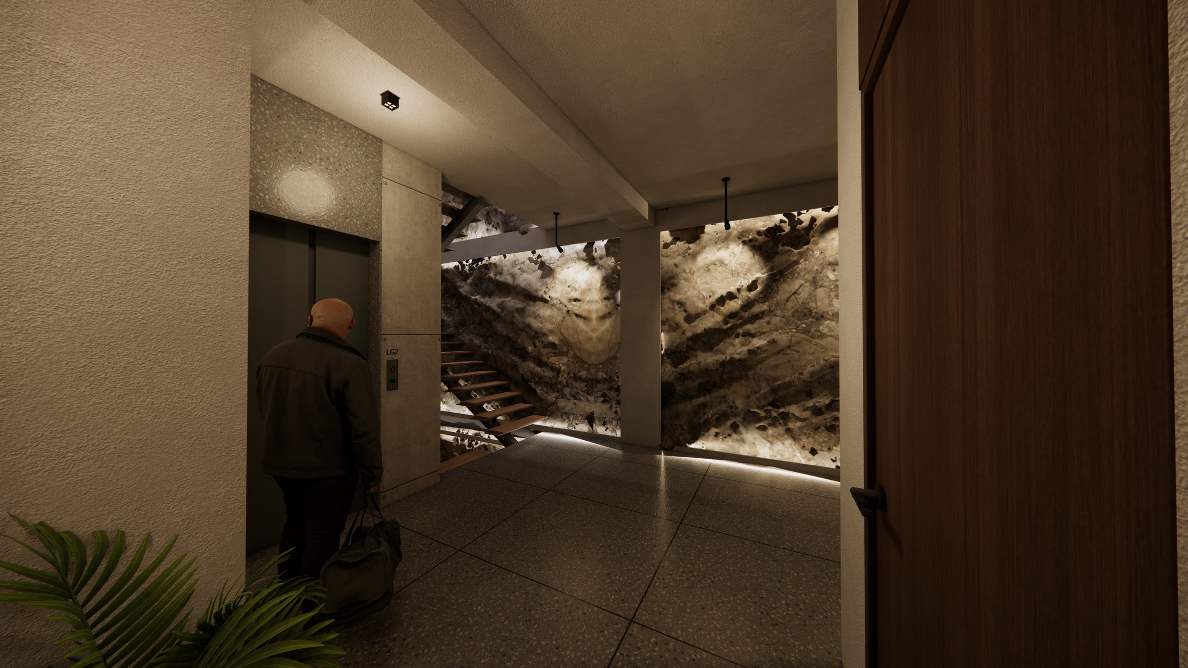Lift lobby with the stone wall and stair beyond